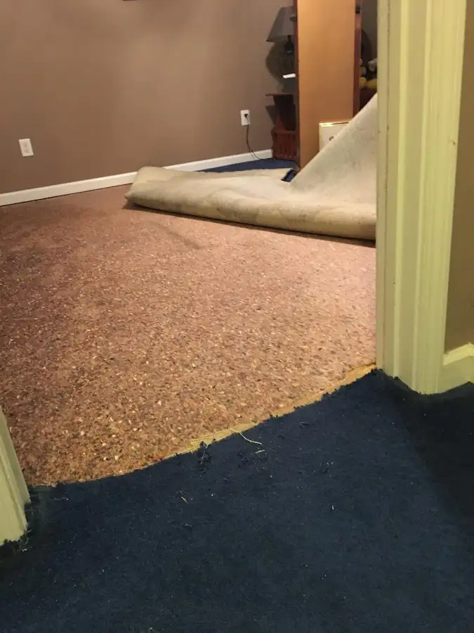 Carpet pad removal revealing water damage during Drying & Dehumidification in Payette